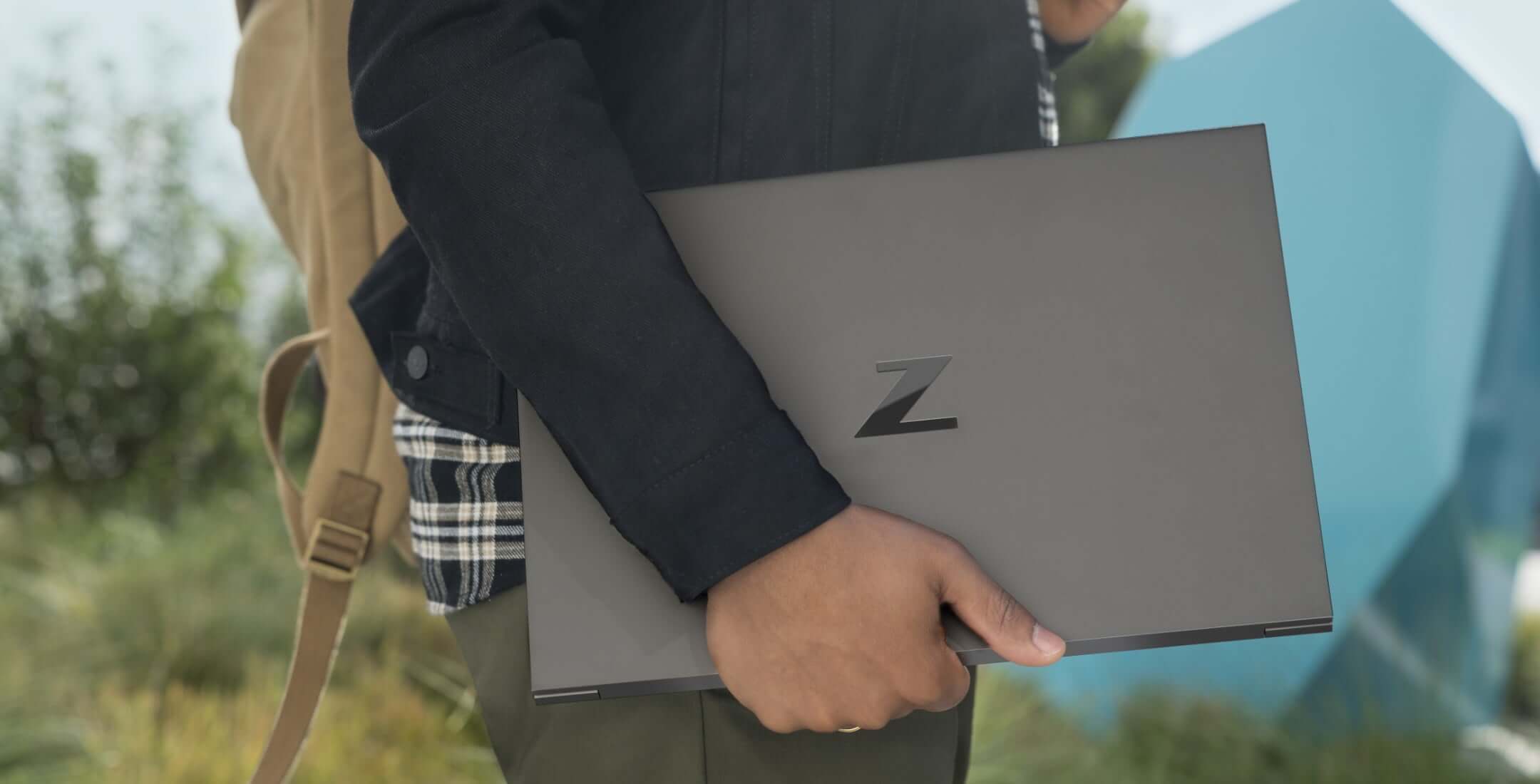 Man carrying Z by HP Laptop