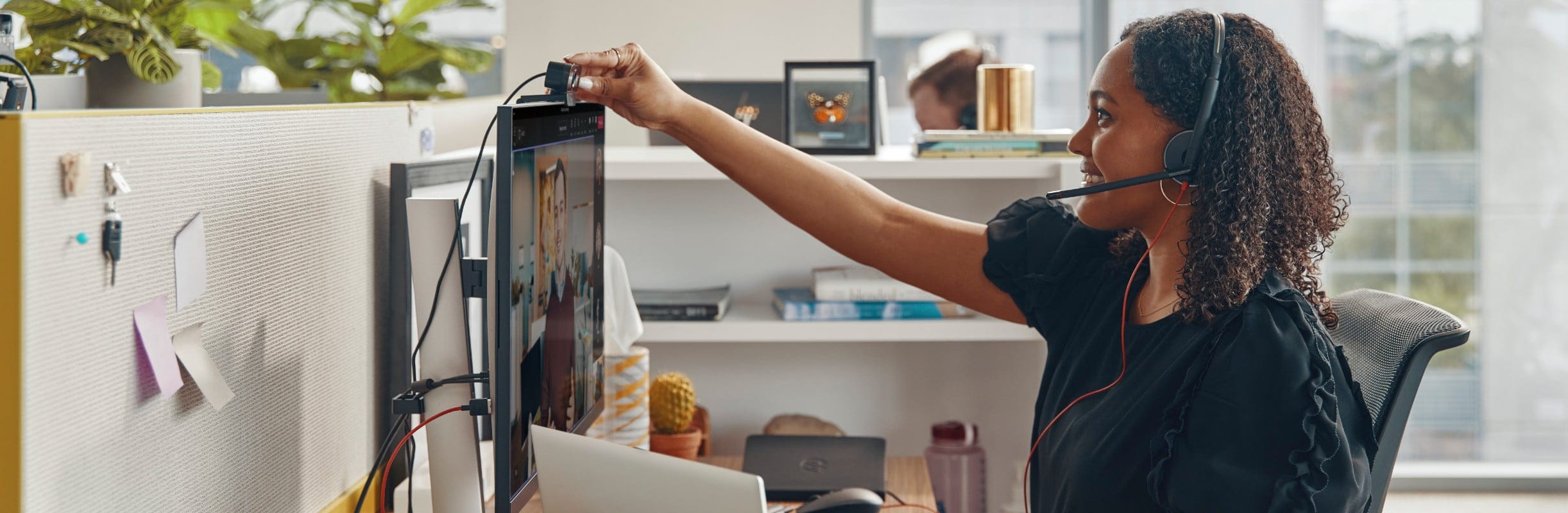 Woman with headset on video call