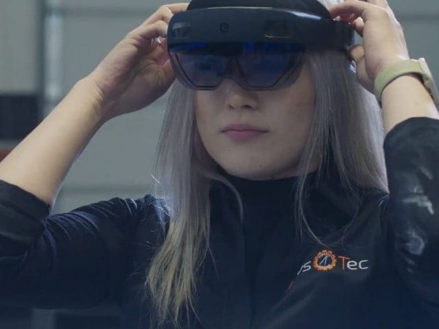 JawsTec team member wearing HoloLens glasses