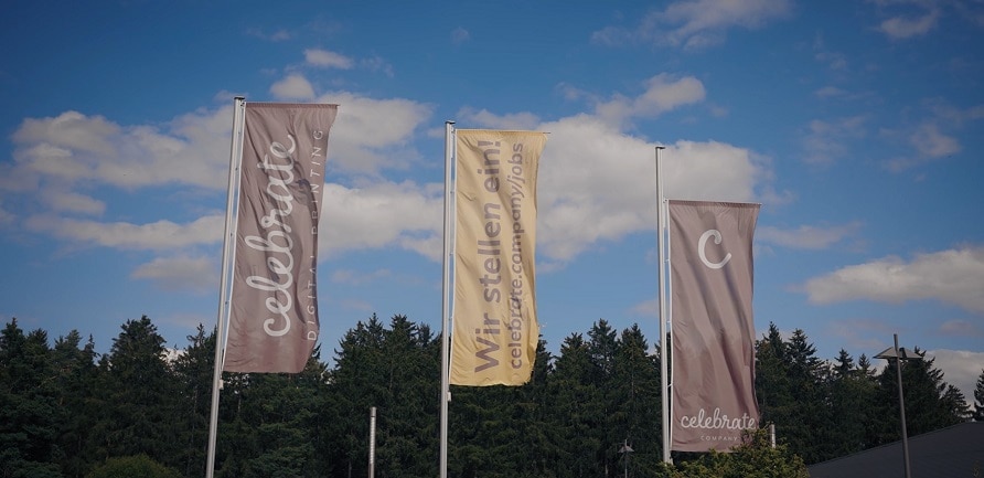 Several banners on poles