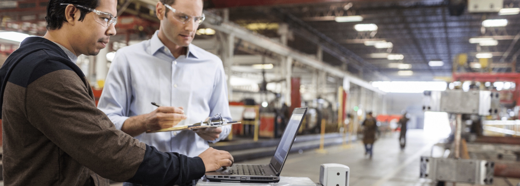 Two workers meet in factory