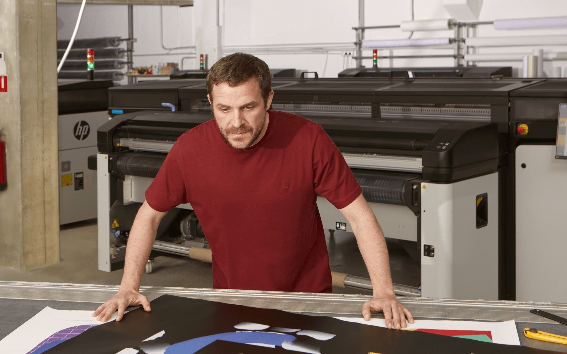 A man looking at some printed materials