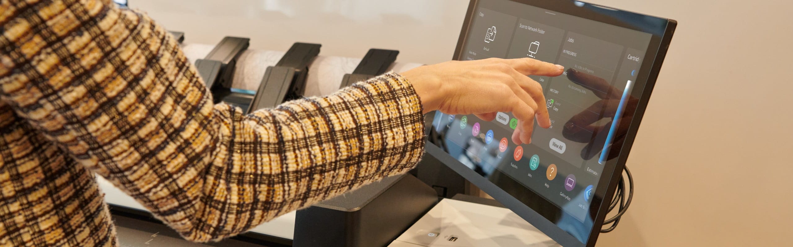 Person using the touchscreen of the HP DesignJet XL 3800 multifunction printer