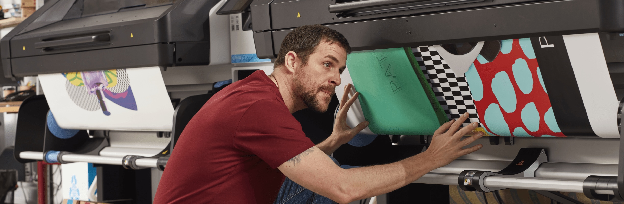 Person checking printed media on an HP Latex printer