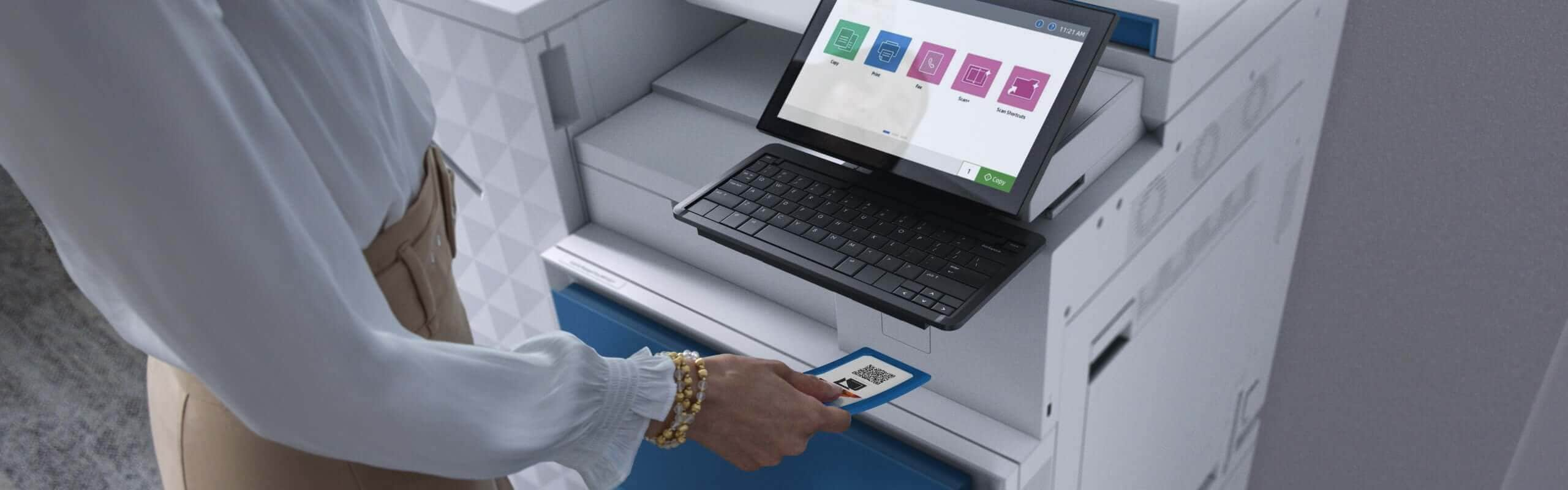 Female office worker looking at HP LaserJet MFP color touchscreen