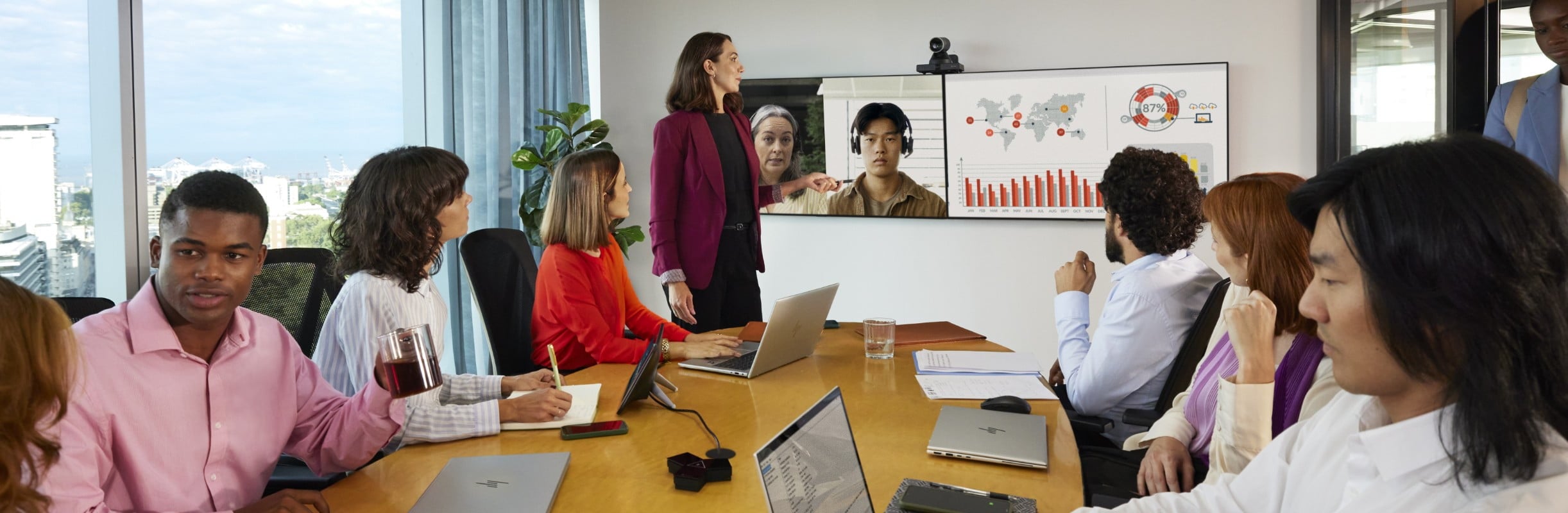 Woman presenting with people in a conference room