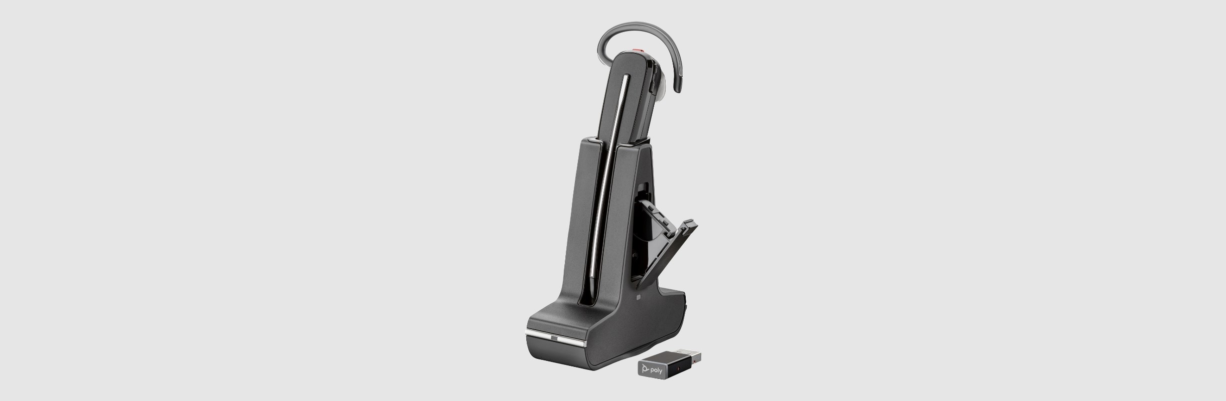 Poly Savi 8245 mono headset on charge stand showing hot-swappable battery and wireless USB