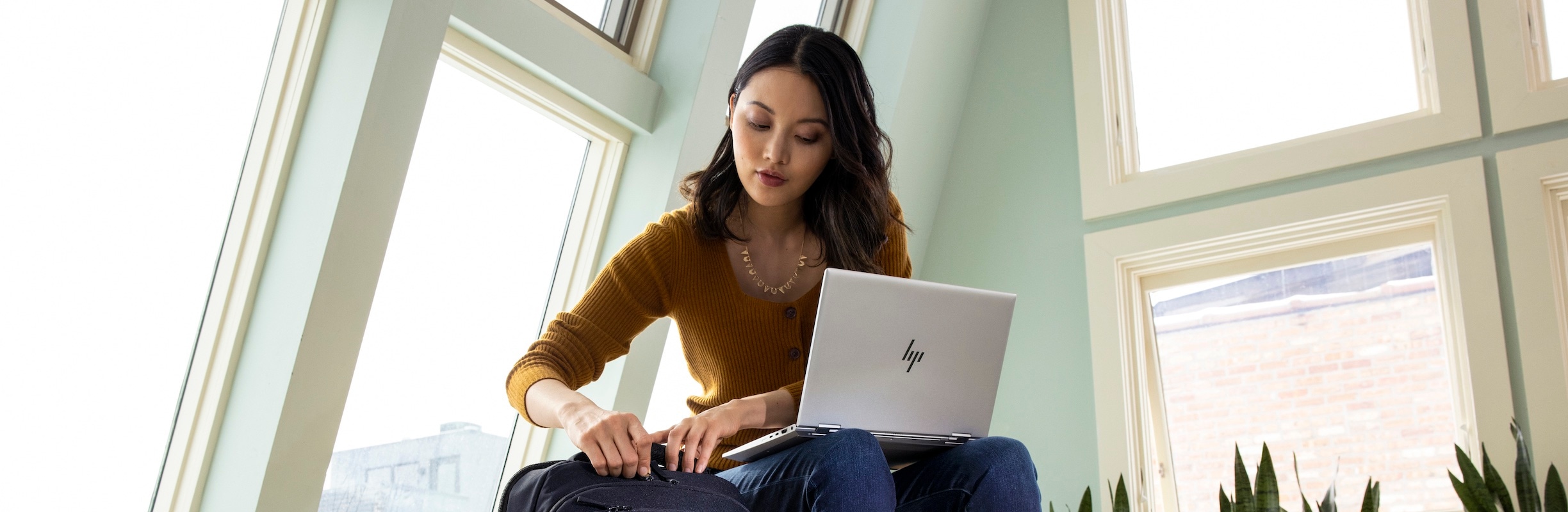 Woman using HP laptop protected while off corporate network