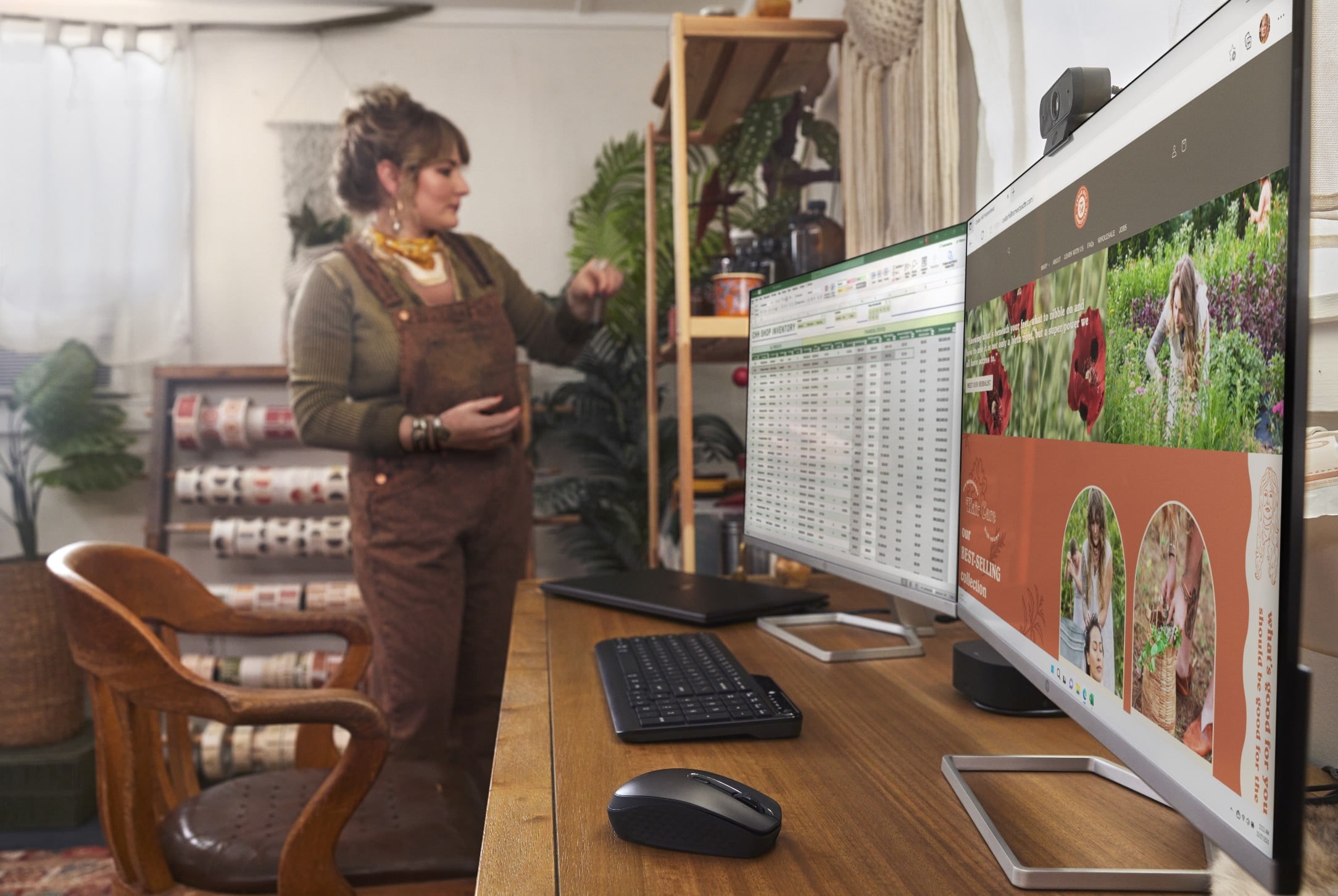 A woman checking some stuff on the shelf aside two HP wide monitors connected to an HP dock.