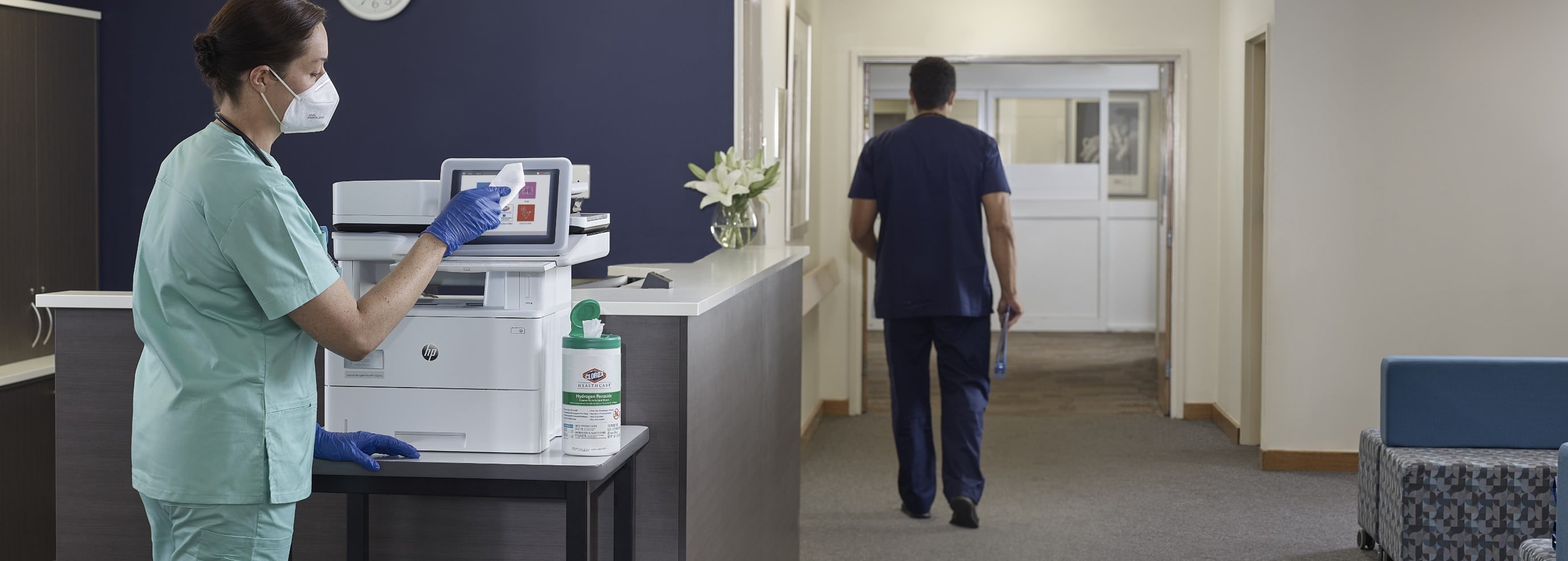 Woman disinfects HP Healthcare Printer