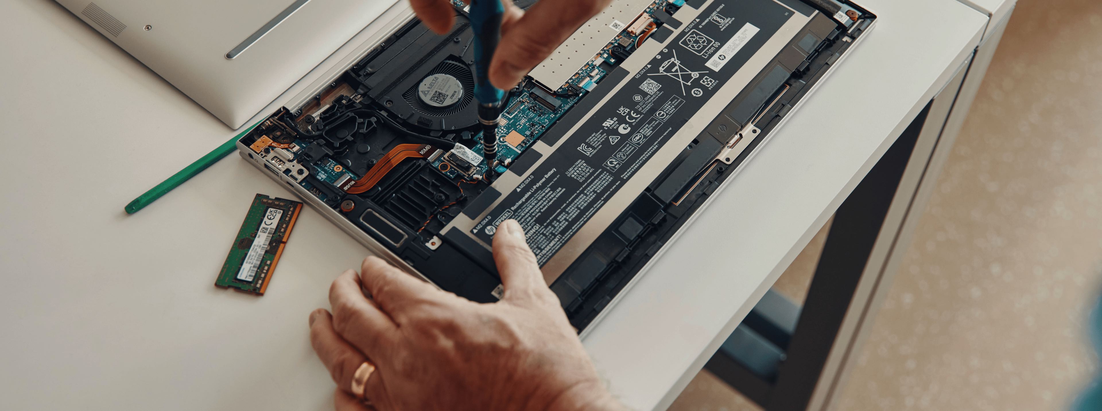 Worker repairing a computer