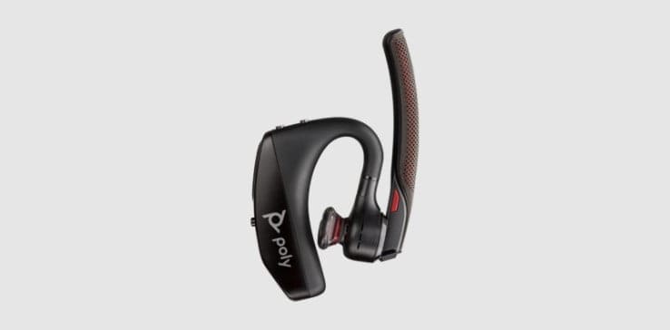 Poly Voyager 5200 Bluetooth mono headset with boom microphone rotated up and eartip pivoted inwards for transport or placement in charging case