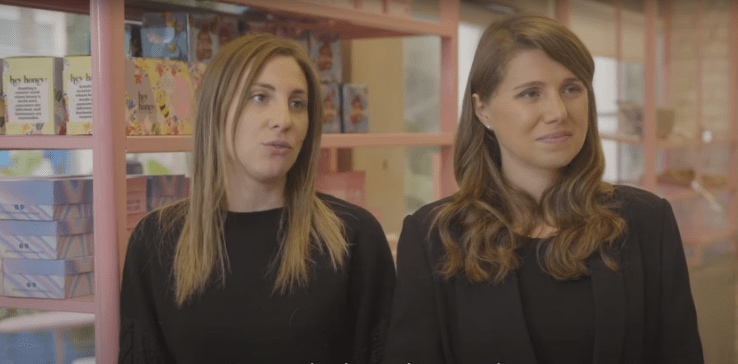 A couple of women in black shirts