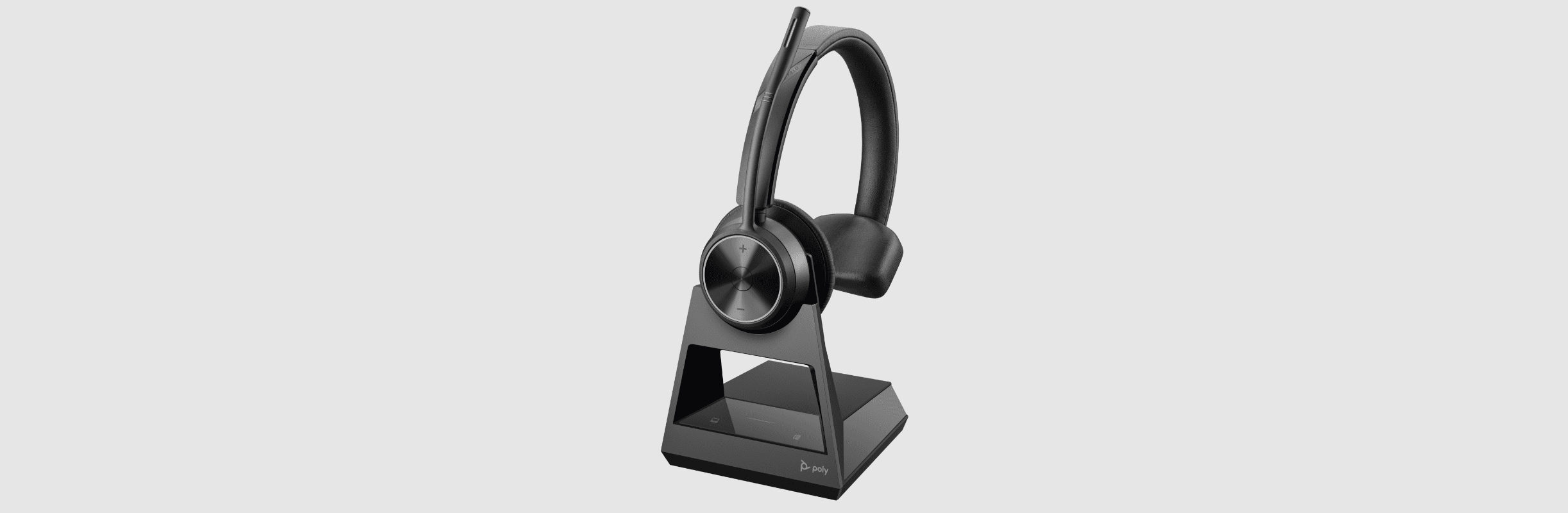 Poly Savi 7310  DECT wireless headset connected to charge stand